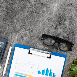 a paper and glasses on a table